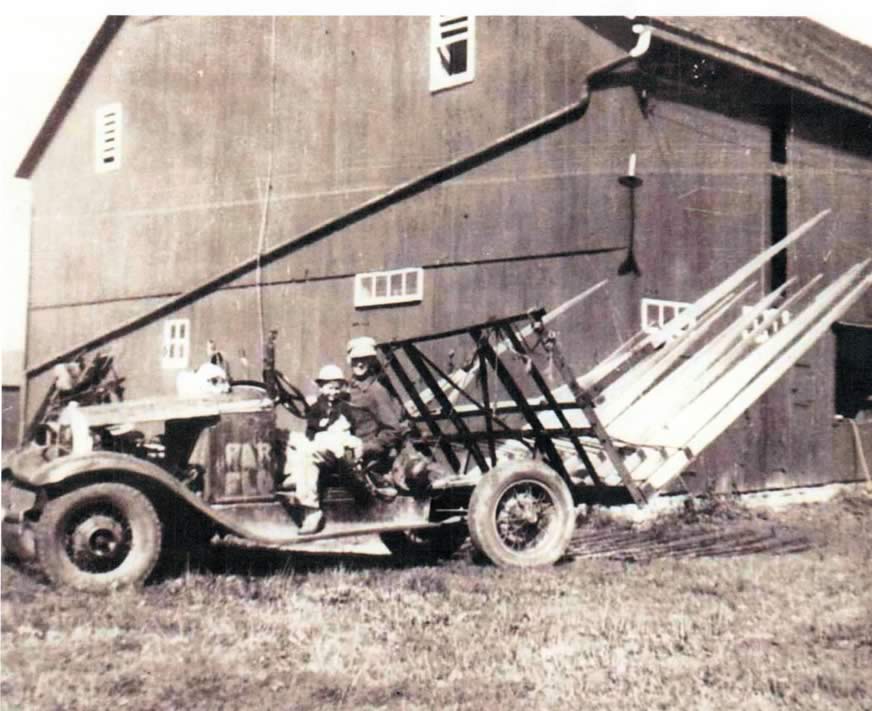Reuben and Larry Henschen and their buckrake.